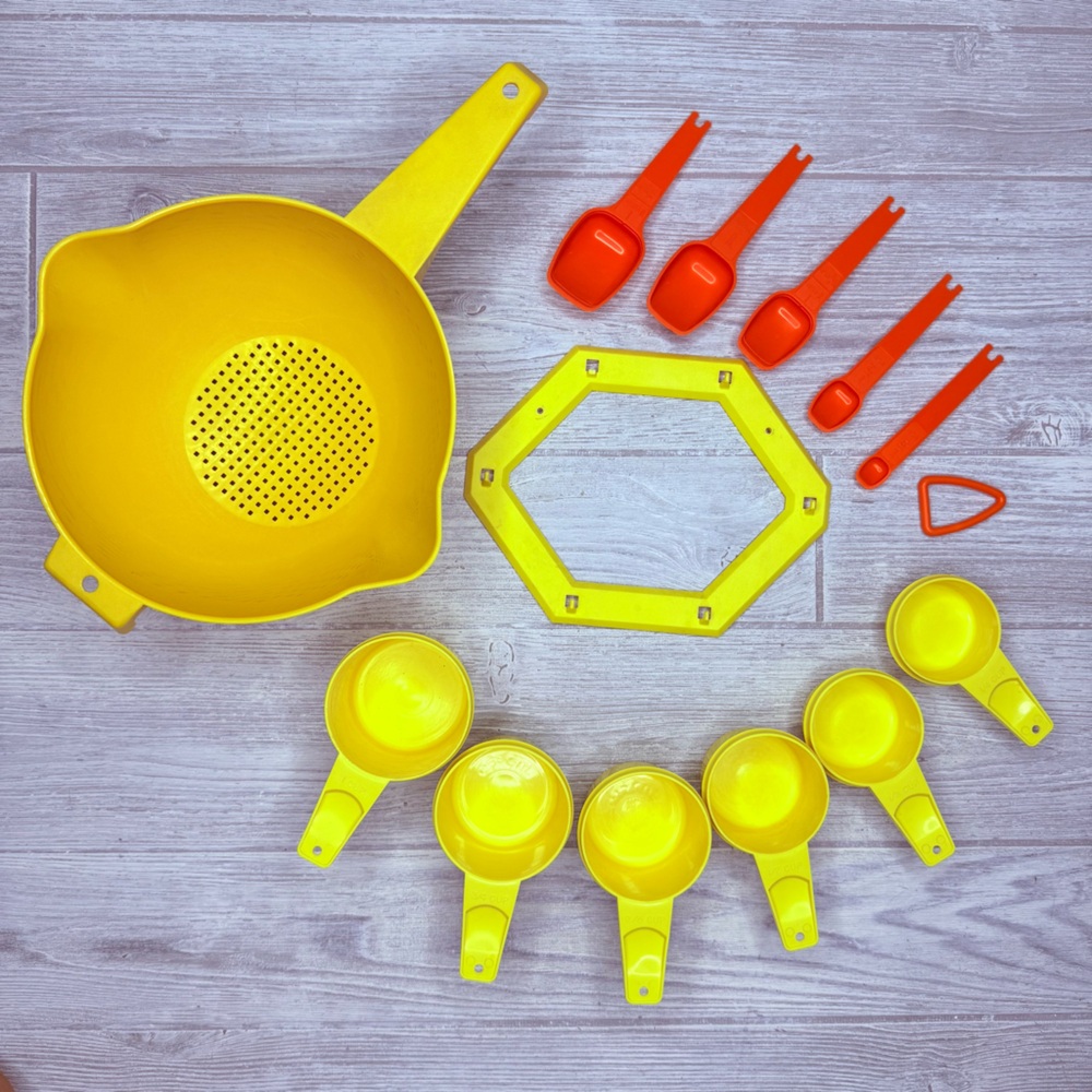 Vintage Tupperware bundle measuring cups , measuring spoons , hooks and strainer